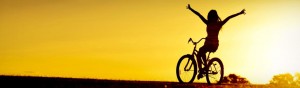 girl-bicycle-silhouette-and-golden-sunset-web-header